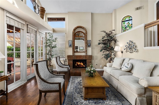 1610 Via Estrella, Pomona, CA 91768 - living room with dark wood-style flooring, plenty of natural light, a brick fireplace, and a high ceiling