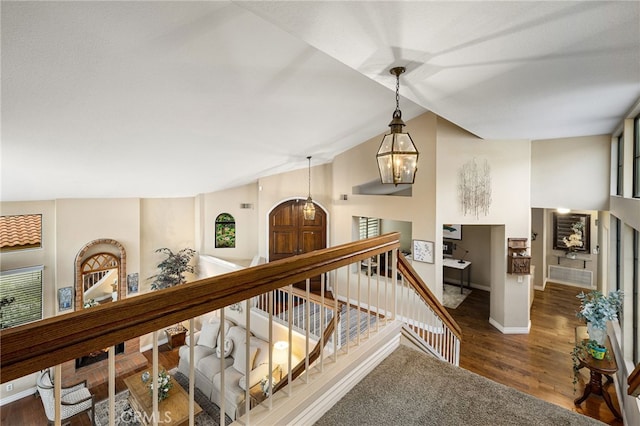 1610 Via Estrella, Pomona, CA 91768 - hallway featuring wood finished floors, lofted ceiling, stairway, and a chandelier
