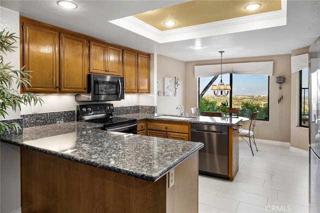 1610 Via Estrella, Pomona, CA 91768 - kitchen with a peninsula, a raised ceiling, brown cabinets, appliances with stainless steel finishes, and crown molding