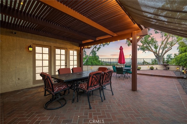 1610 Via Estrella, Pomona, CA 91768 - patio terrace at dusk featuring outdoor dining space, a patio area, and a pergola