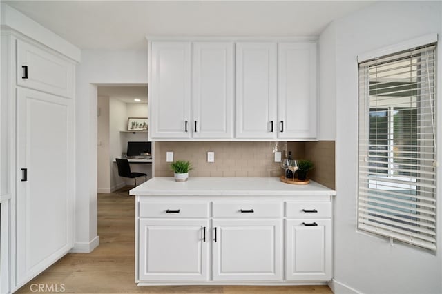 3705 Cypress Ln, Yorba Linda, CA 92886 - kitchen with light wood-style floors, tasteful backsplash, light countertops, and white cabinetry