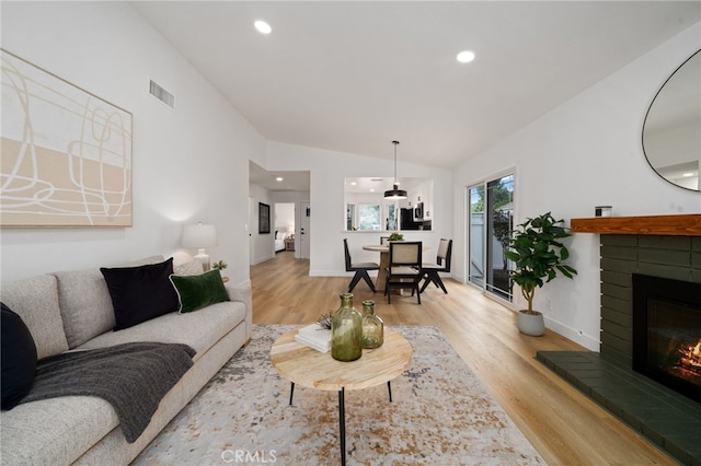 3705 Cypress Ln, Yorba Linda, CA 92886 - living area featuring lofted ceiling, light wood-style flooring, a brick fireplace, and recessed lighting