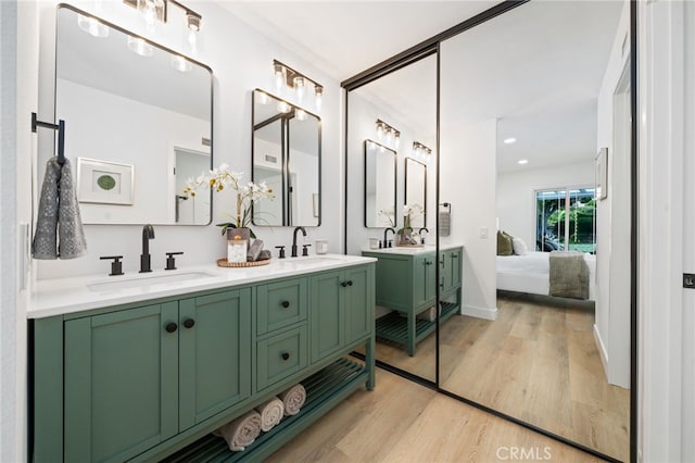 3705 Cypress Ln, Yorba Linda, CA 92886 - bathroom featuring wood finished floors, ensuite bathroom, double vanity, and recessed lighting