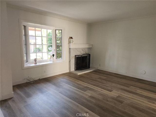 17077 Los Modelos St, Fountain Valley, CA 92708 - unfurnished living room featuring crown molding, dark wood-style floors, and a premium fireplace