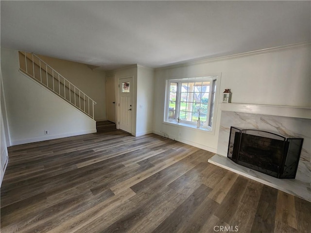 17077 Los Modelos St, Fountain Valley, CA 92708 - unfurnished living room featuring wood finished floors, a premium fireplace, stairway, and ornamental molding