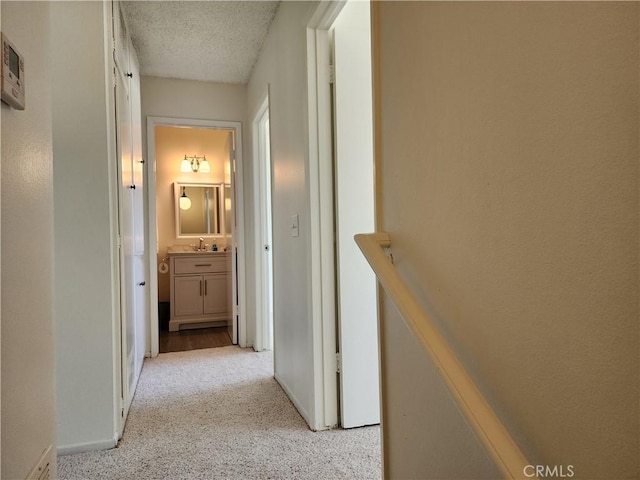 17077 Los Modelos St, Fountain Valley, CA 92708 - hall featuring light carpet and a textured ceiling