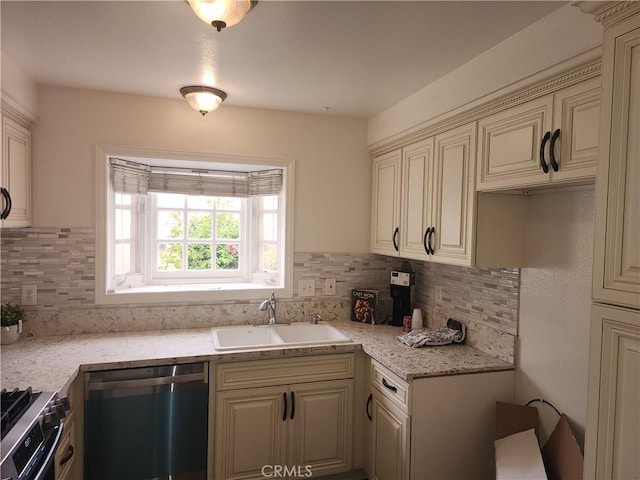 17077 Los Modelos St, Fountain Valley, CA 92708 - kitchen with cream cabinetry, dishwashing machine, decorative backsplash, and stainless steel stove