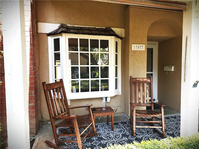 17077 Los Modelos St, Fountain Valley, CA 92708 - view of exterior entry featuring covered porch and stucco siding