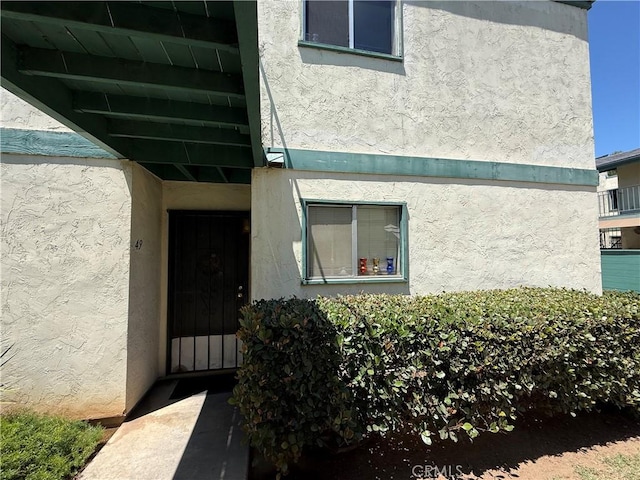 1817 E Grand Ave Unit 49, Escondido, CA 92027 - doorway to property with stucco siding