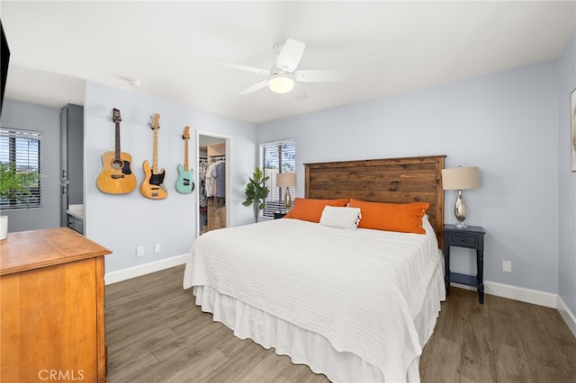 45 Bramble Ln Unit 109, Aliso Viejo, CA 92656 - bedroom featuring wood finished floors, a spacious closet, and a ceiling fan
