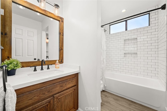 45 Bramble Ln Unit 109, Aliso Viejo, CA 92656 - bathroom featuring vanity, shower / bath combo with shower curtain, and wood finished floors