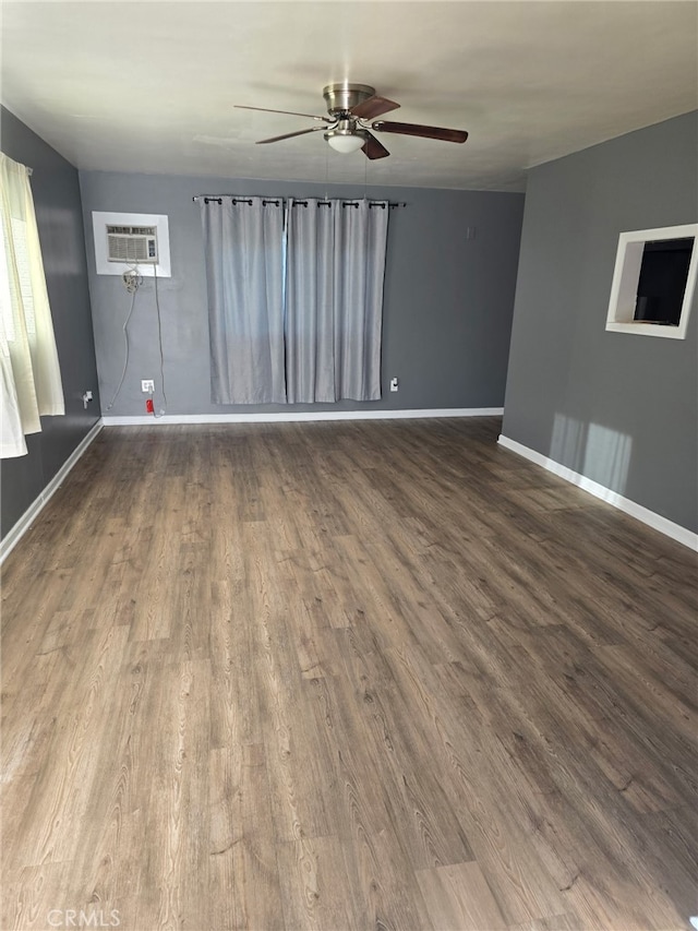625 Xenia Ave, Beaumont, CA 92223 - empty room featuring a ceiling fan, dark wood-style flooring, and a wall mounted AC