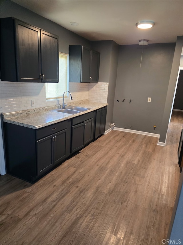 625 Xenia Ave, Beaumont, CA 92223 - kitchen with tasteful backsplash, light wood-type flooring, and light countertops