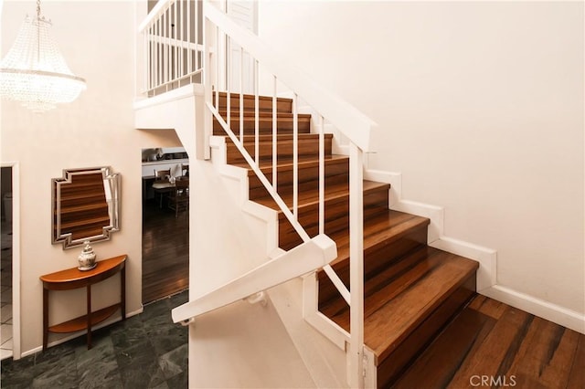 5440 Lindley Ave Unit 310, Encino, CA 91316 - stairs with a chandelier and wood finished floors