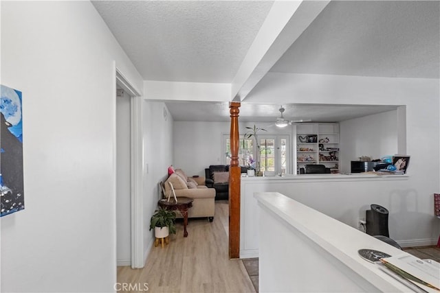 1062 Golden Rain St, Upland, CA 91786 - hallway featuring a textured ceiling and light wood-style flooring