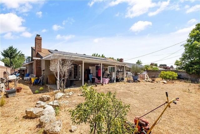 1062 Golden Rain St, Upland, CA 91786 - rear view of property with solar panels, a chimney, and a patio area