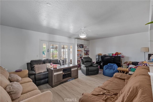 1062 Golden Rain St, Upland, CA 91786 - living room featuring french doors, light wood-style flooring, a ceiling fan, and a textured ceiling