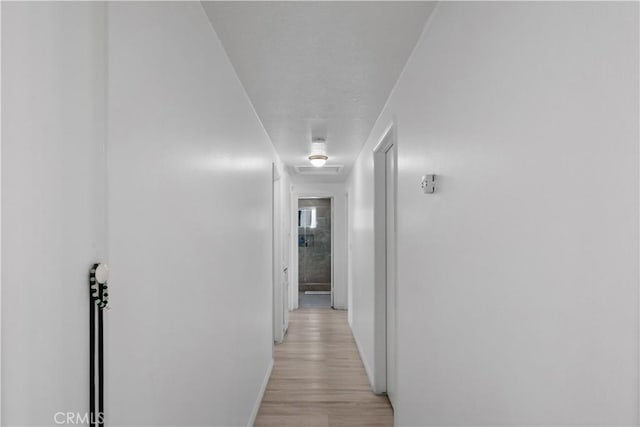1062 Golden Rain St, Upland, CA 91786 - hallway with baseboards and light wood finished floors
