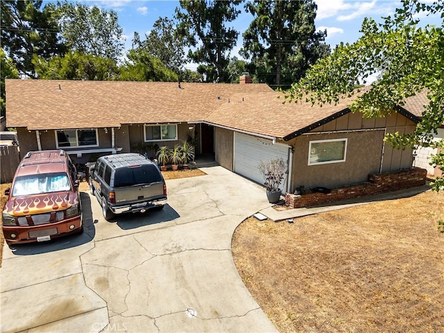 1062 Golden Rain St, Upland, CA 91786 - ranch-style home featuring roof with shingles, driveway, a garage, and board and batten siding