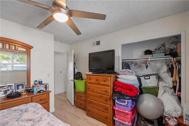 1062 Golden Rain St, Upland, CA 91786 - bedroom featuring a textured ceiling, wood finished floors, and a ceiling fan