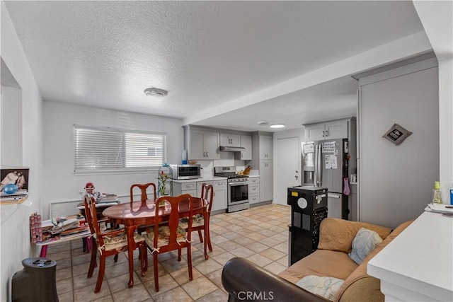 1062 Golden Rain St, Upland, CA 91786 - dining room featuring a textured ceiling and light tile patterned floors