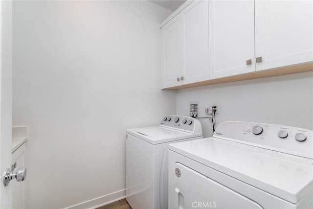 27554 Sparrow Ct, Valencia, CA 91381 - laundry room featuring cabinet space and washer and clothes dryer