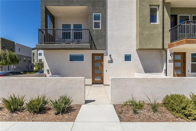 27554 Sparrow Ct, Valencia, CA 91381 - view of front of home featuring a balcony and stucco siding