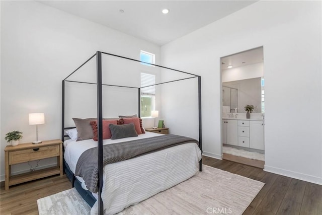 27554 Sparrow Ct, Valencia, CA 91381 - bedroom with wood finished floors, recessed lighting, and ensuite bathroom