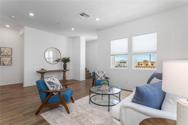 27554 Sparrow Ct, Valencia, CA 91381 - sitting room with stairway, wood finished floors, and recessed lighting