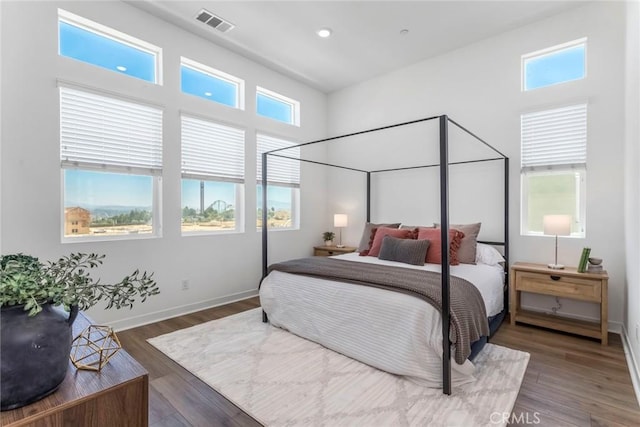 27554 Sparrow Ct, Valencia, CA 91381 - bedroom featuring wood finished floors, recessed lighting, and a towering ceiling