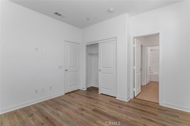27554 Sparrow Ct, Valencia, CA 91381 - unfurnished bedroom featuring wood finished floors and a closet