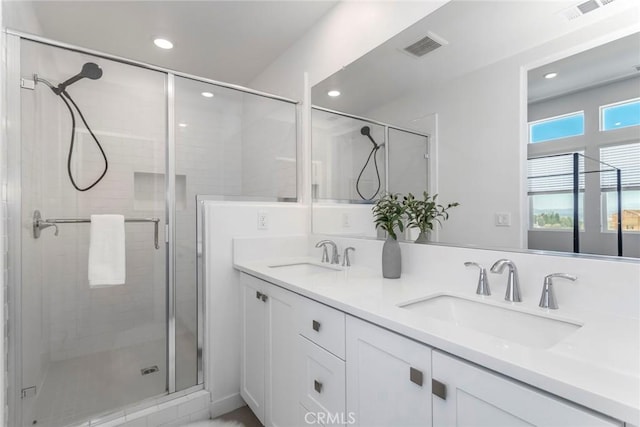 27554 Sparrow Ct, Valencia, CA 91381 - full bathroom with double vanity, a stall shower, and recessed lighting