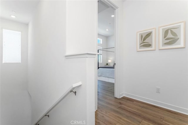 27554 Sparrow Ct, Valencia, CA 91381 - hallway with wood finished floors, an upstairs landing, and recessed lighting