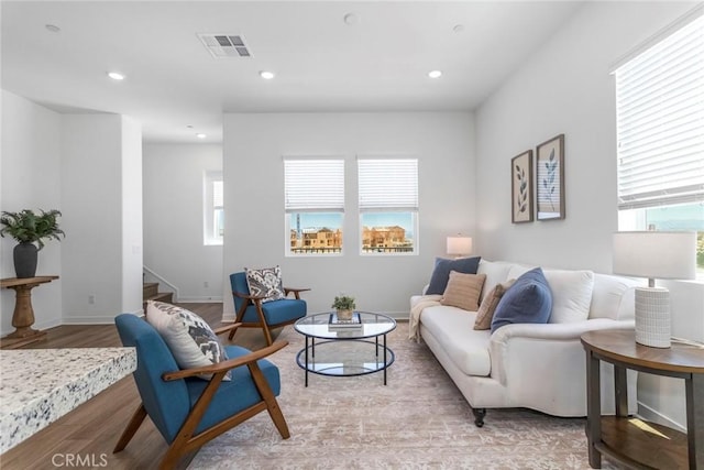 27554 Sparrow Ct, Valencia, CA 91381 - living area with plenty of natural light, light wood-style flooring, stairs, and recessed lighting