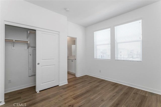 27554 Sparrow Ct, Valencia, CA 91381 - unfurnished bedroom with wood finished floors, a closet, and connected bathroom