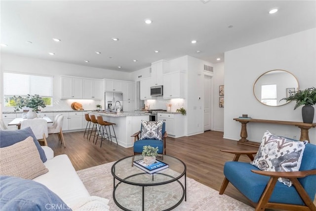 27554 Sparrow Ct, Valencia, CA 91381 - living area with recessed lighting and wood finished floors