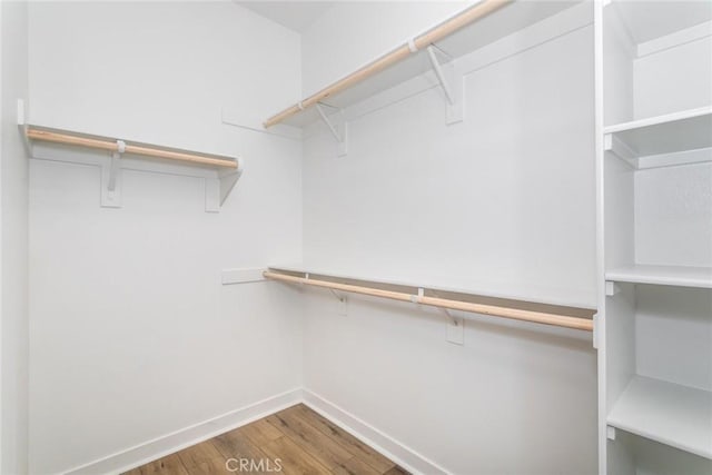 27554 Sparrow Ct, Valencia, CA 91381 - walk in closet with wood finished floors
