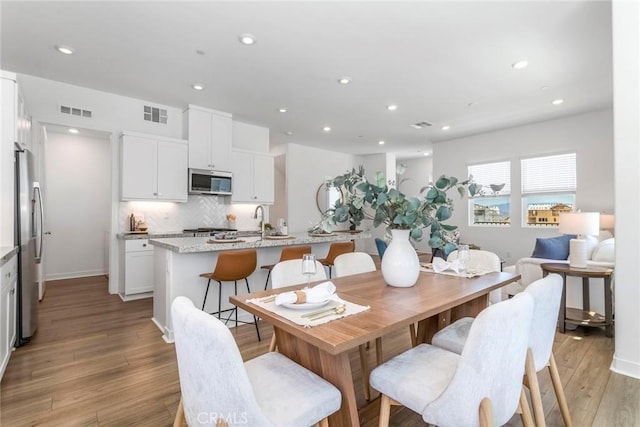 27554 Sparrow Ct, Valencia, CA 91381 - dining room with light wood-style flooring and recessed lighting