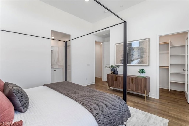 27554 Sparrow Ct, Valencia, CA 91381 - bedroom featuring wood finished floors, a spacious closet, and recessed lighting