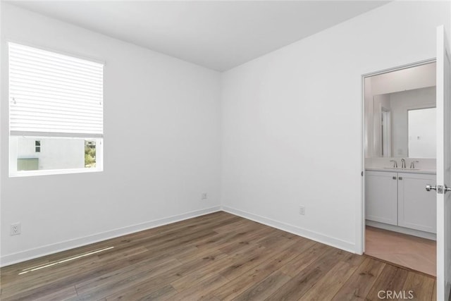 27554 Sparrow Ct, Valencia, CA 91381 - spare room with wood finished floors and baseboards