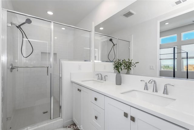 27554 Sparrow Ct, Valencia, CA 91381 - bathroom featuring double vanity, a stall shower, and recessed lighting