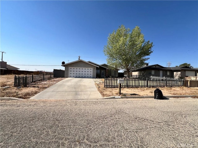 7512 Xavier Ave, California City, CA 93505 - single story home with a fenced front yard, an attached garage, and driveway