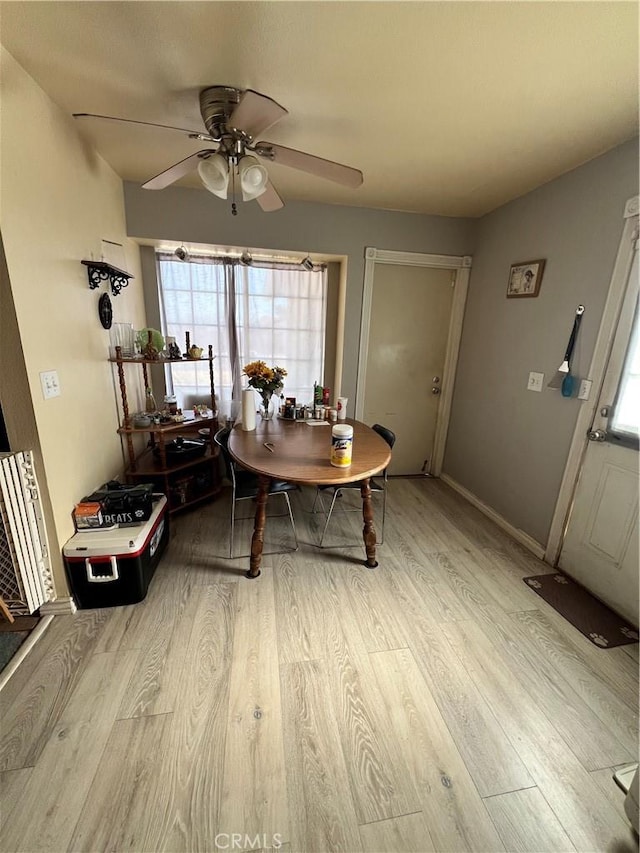 7512 Xavier Ave, California City, CA 93505 - dining area featuring a ceiling fan and wood finished floors