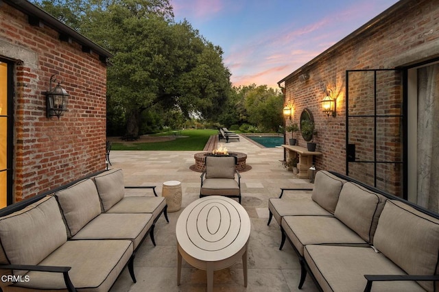 1370 Hillcrest Ave, Pasadena, CA 91106 - patio terrace at dusk featuring an outdoor living space with a fire pit and a patio area