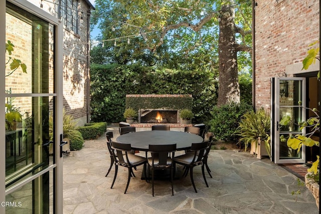 1370 Hillcrest Ave, Pasadena, CA 91106 - view of patio / terrace featuring an outdoor brick fireplace and outdoor dining space