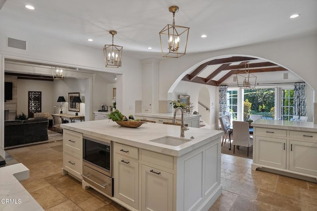 1370 Hillcrest Ave, Pasadena, CA 91106 - kitchen with arched walkways, a chandelier, recessed lighting, beamed ceiling, and open floor plan