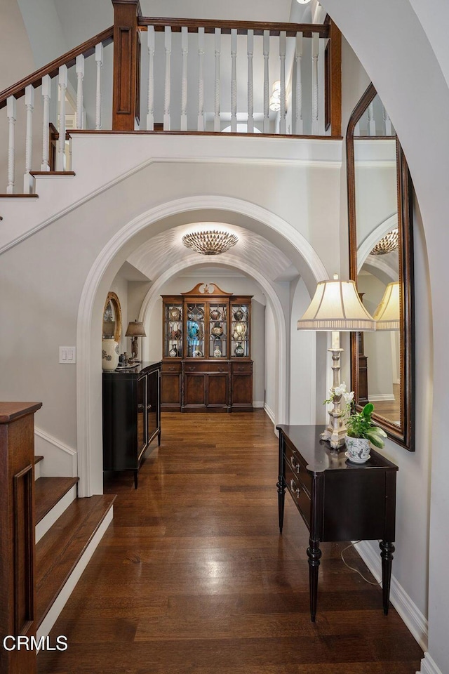 1370 Hillcrest Ave, Pasadena, CA 91106 - foyer entrance featuring arched walkways, wood finished floors, and stairway
