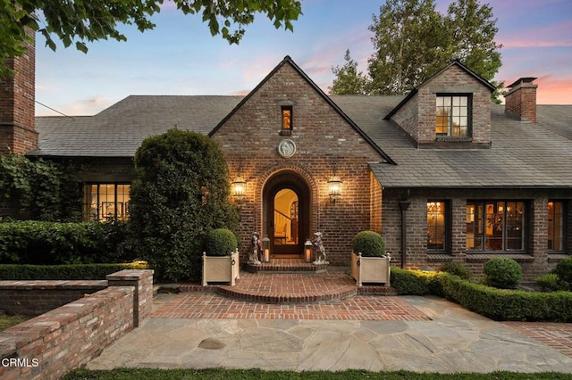 1370 Hillcrest Ave, Pasadena, CA 91106 - view of front of property featuring brick siding, a patio area, and a chimney