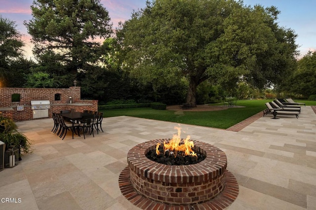 1370 Hillcrest Ave, Pasadena, CA 91106 - view of patio with an outdoor fire pit, outdoor dining space, view of scattered trees, and area for grilling