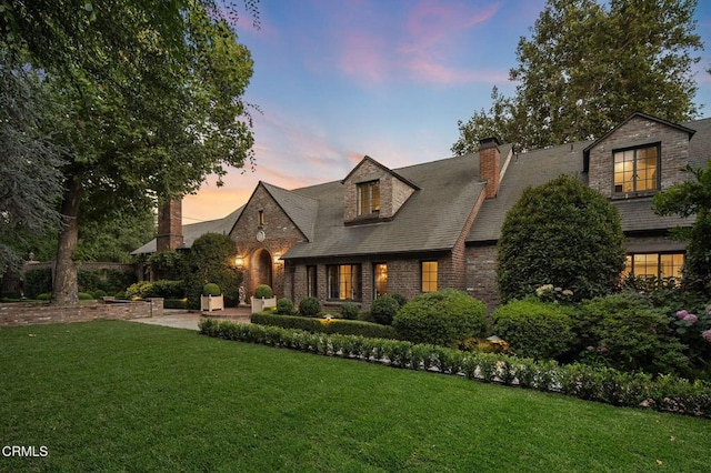 1370 Hillcrest Ave, Pasadena, CA 91106 - view of front of home featuring a chimney, a lawn, a patio, and brick siding